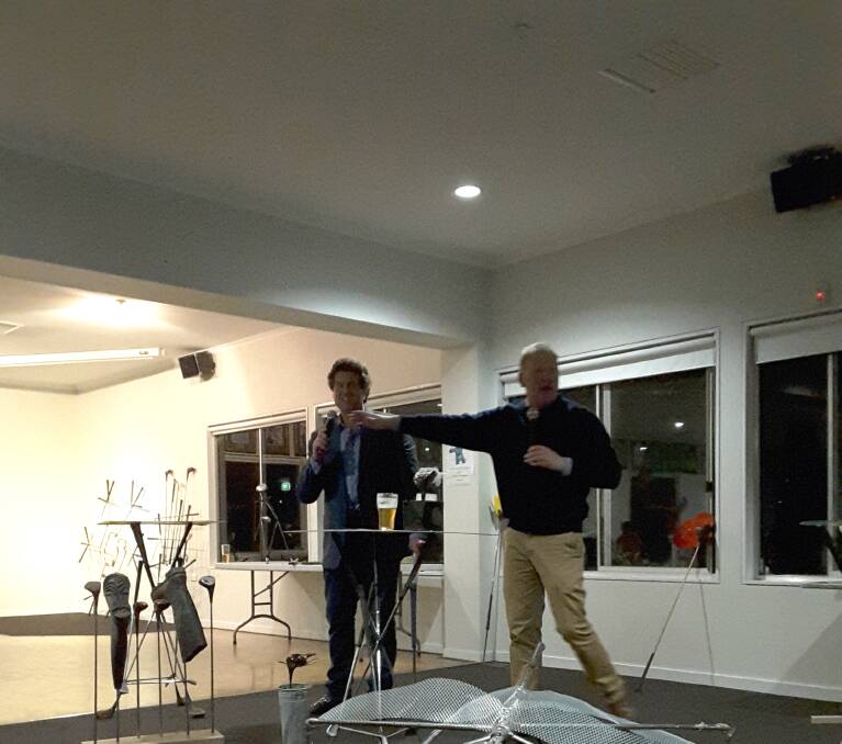 GOING, GOING, GONE: MC Stu Williams and auctioneer Col Medway ran the art auction following the successful golf day.