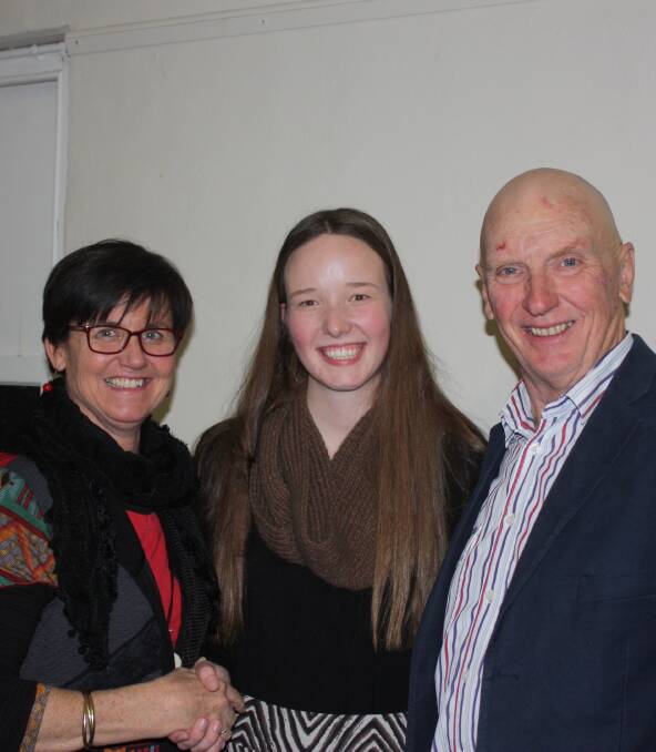 THE FUTURE OF AGRICULTURE: Cath Williams and Phil Armour present student Sarah Targett with the Yass Veterinary Hospital prize for excellence in Agricultural studies. 