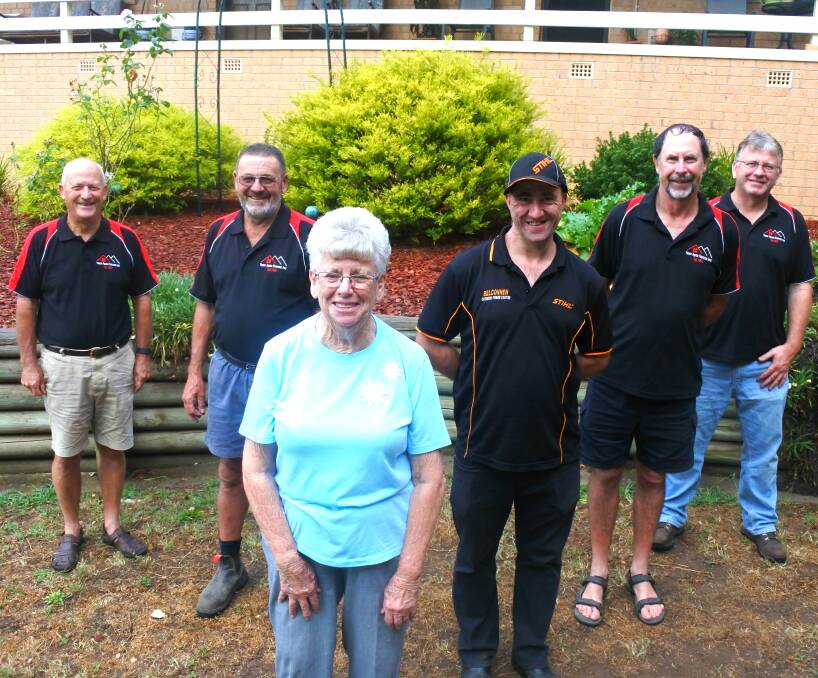 Village living: The Yass Apex Village board with resident Jeanette Waters at one of the village's many gardens. Photo: Jessica Cole. 