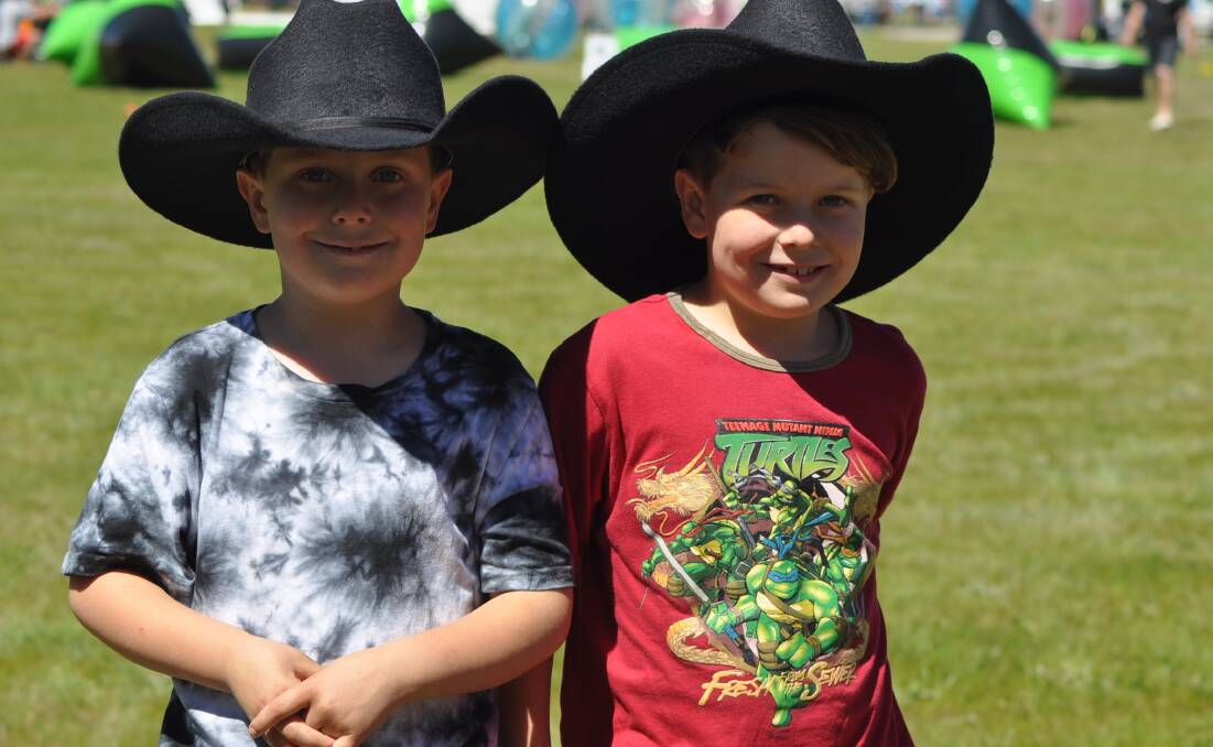 Smiles all round: Bob and Josh Smith enjoy a day out in the sun at the Murrumbateman Field Days at the weekend. Photo: Jessica Cole. 