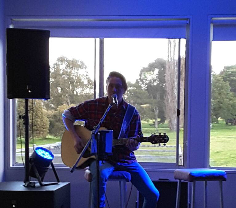 SOULFUL: Talented young musician Abel Davaris entertaining the crowd at the Yass Golf Club prior to the auction.