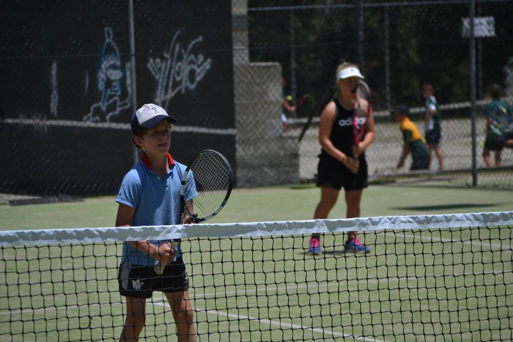 Ready and waiting: 66 kids took to the Hume Tennis Club courts today to test their skills and compete in a friendly environment with their friends as their doubles partners. Photo: Zac Lowe.
