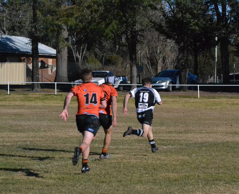 Harry Bush streaks away from Taralga players as he scores his one try for the afternoon. Photo: Zac Lowe. 