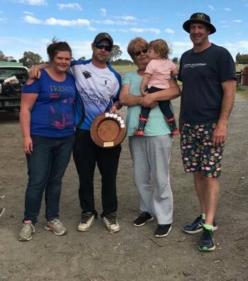 (Left to right)  Regan Laughton (Greg's daughter), Mitch Quinn, captain of the Young Guns with the Greg Laughton trophy, Kerry Laughton and Ivy Worboys (Greg's wife and granddaughter), and Andrew Clarke, captain of the Old Dogs. Photo: Andrew McLean