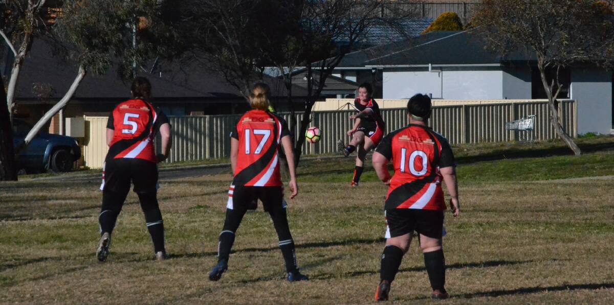 Standing guard: The Redbacks are strong in defense against a corner attempt from Palerang, one of many unsuccessful attempts during the afternoon. Photo: Zac Lowe. 