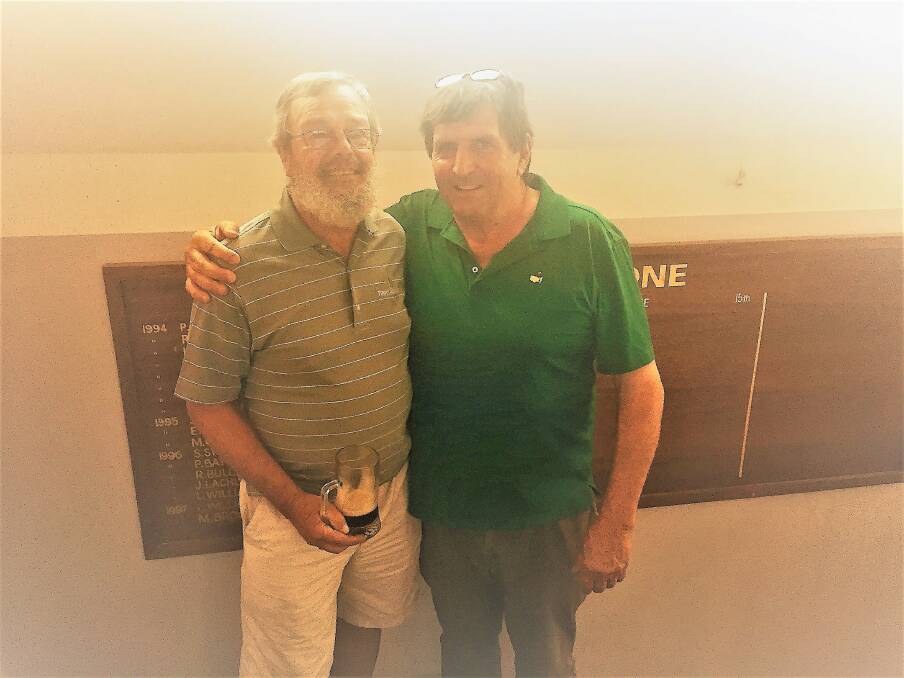 The 'April Guzzler': Golfers Kim Stephan and Easter Monday's winner Mick Abbey. Photo: Neville Matthews