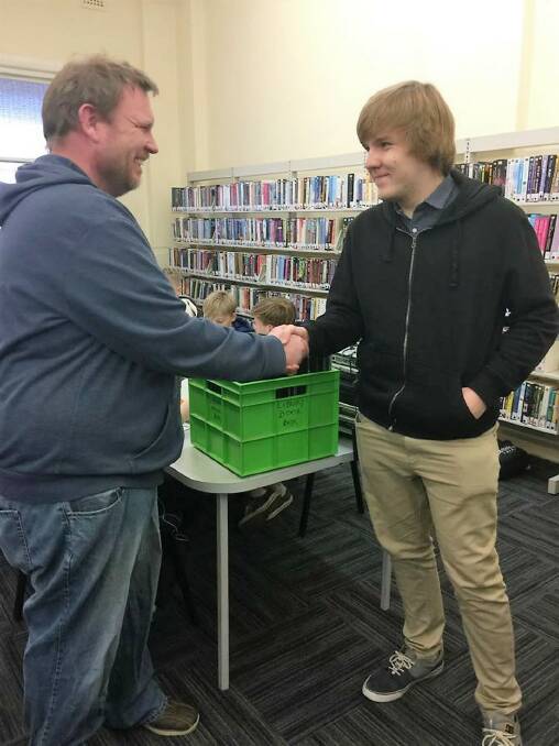 A kind gift: A very happy David Osborne (left) accepts Yass High School's old laptops on behalf of Yass IT last Monday. Photo: Yass IT