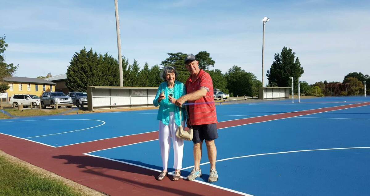 Officially opened: Peg Keogh, wife of former sports council member Norm Keogh, and YNA executive member David Kemp cut the ribbon at O'Connor Park. Photo: Supplied