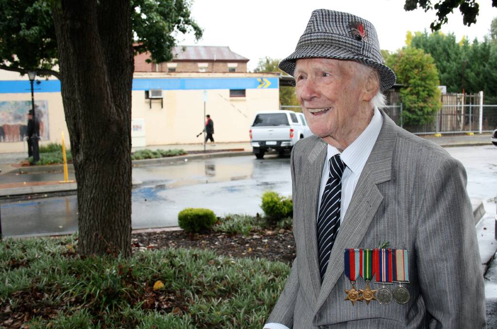 LEST WE FORGET: World War II veteran Colin Allender before the Anzac Day march in Yass, his service medals pinned proudly to his chest. Photos: Alix Douglas.