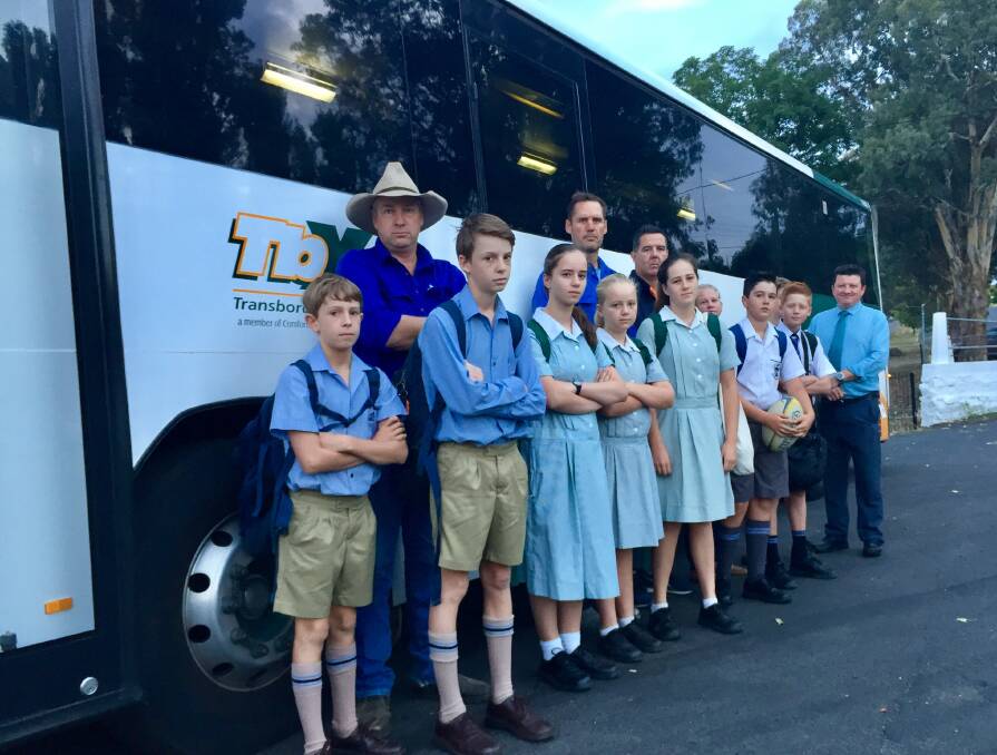 NEW BUS SOUGHT: Duncan Waugh (centre) with a number of the students and parents voicing for a bus that travels from Yass via Murrumbateman directly (bypassing Hall) to schools in southern Canberra. Photo: Toby Vue