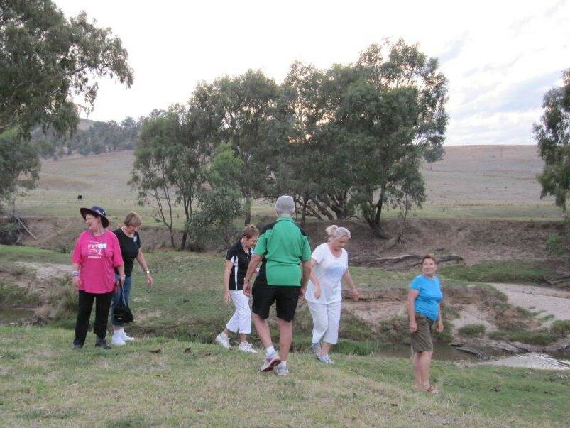 Out and exercising: A group of participants conducting light cadio exercises at Tarcutta Creek during the 2015 'Active Life Weekend' program. Photo: Pauline Santin