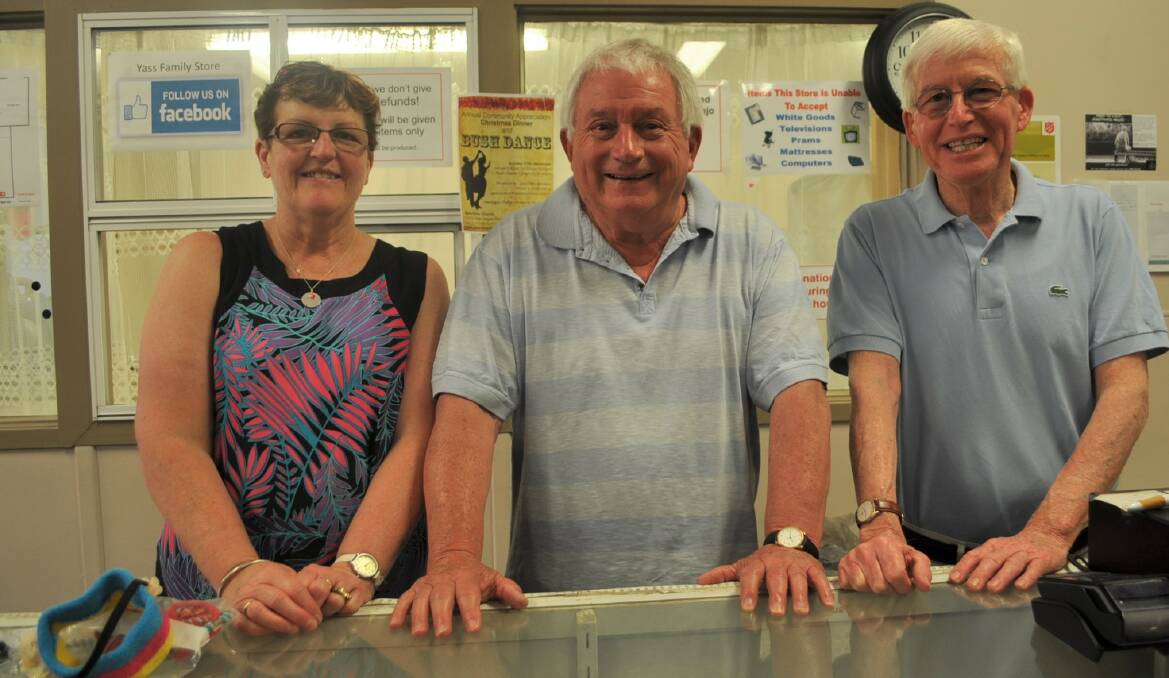 HELPING OUT: Len McGuigan (centre) presented Linda Scarlett and Michael Van Wanroy with $300 each to help them with the Christmas period. The money was raised from Yass Valley Men's Shed exercise program. Photo: Toby Vue