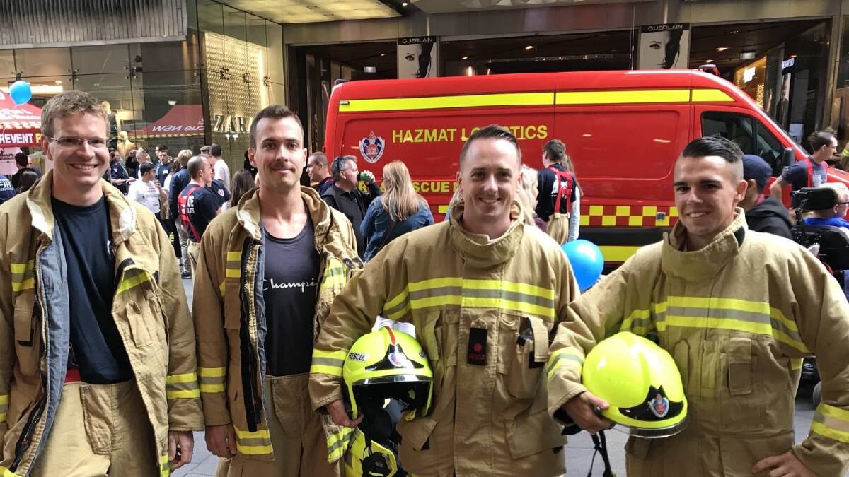 CLIMBING FOR A CAUSE: Yass Fire and Rescue crew members — Ben Daetwyler, Matthew Pollard, Scott Lang and Nick Whiting — climb the Sydney Eye Tower to raise funds for Motor Neurone Disease (MND) research. Photo: Supplied