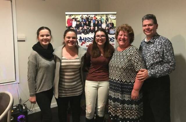 SURPRISE VISIT: Steph Davis (centre) with the Critchley family (Eleanor, Matilda, Jillian and Peter), who provided Ms Davis with a surprise visit on the trivia night on June 17 at the Yass Golf Club. Photo: Supplied