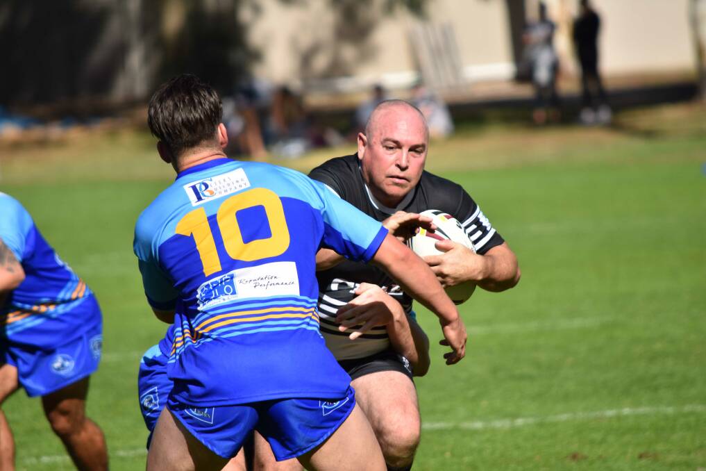 UNSTOPPABLE: Anthony ('Tony') Worthy, 38, carries the ball for a strong run towards the opposition. He will play his 250th game for the Yass Magpies Rugby League Club on Saturday, May 6. Photo: Canberra Region Rugby League