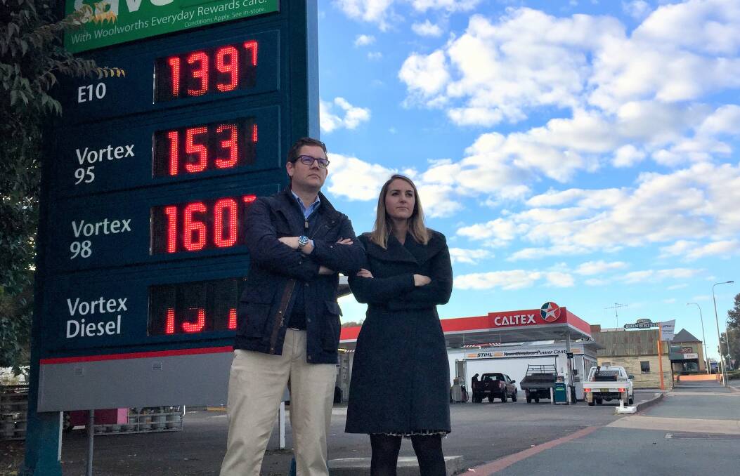 TAKING ACTION: Nick Tyrrell, who began the petition to the ACCC, with wife Lauren outside one of the Yass Caltex stations. Photo: Toby Vue