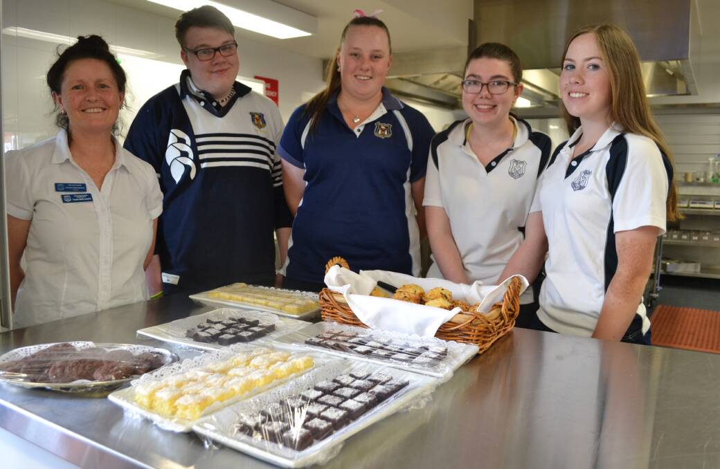 LEADING THE WAY: Annette Halley-Barberis, one of the workplace learning coordinators in hospitality, with students Anthony Reid, Emily Polsen, Stephanie Davis and Breanna Lennon. Photo: Toby Vue
