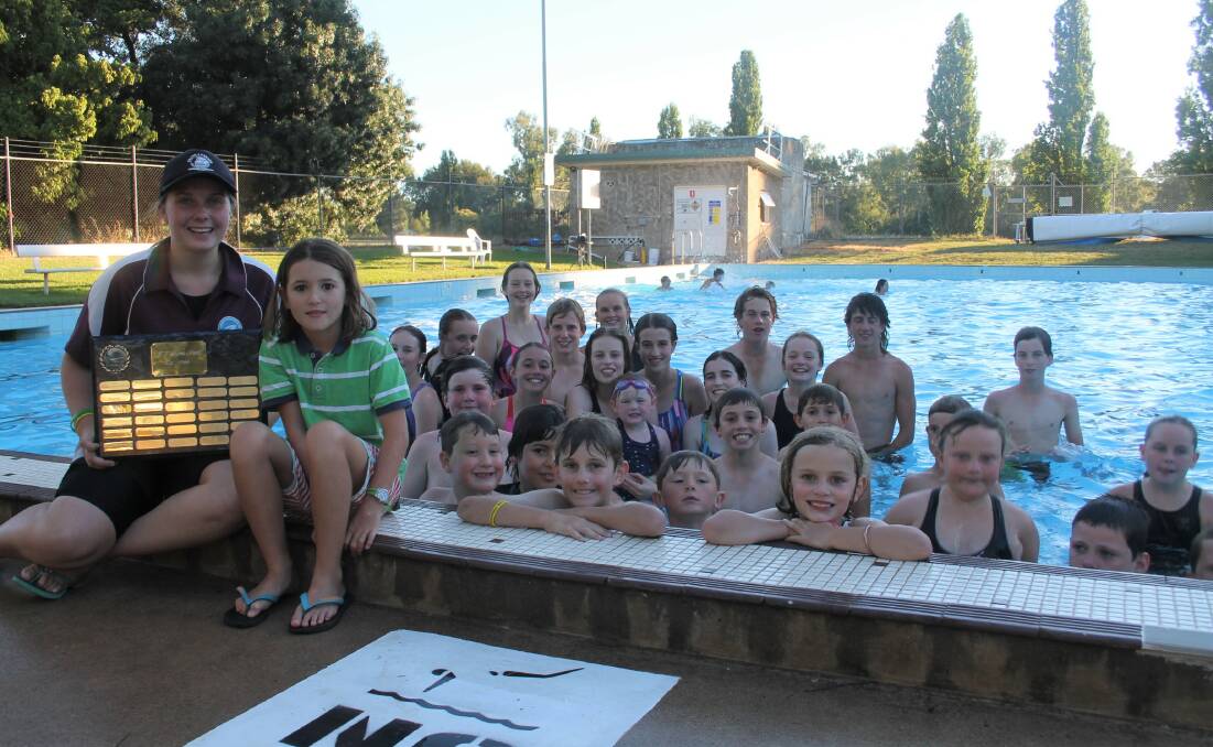PIC OF THE WEEK: Junior swimmers, with coach Katia Manton, at the Jugiong club are all smiles after winning the coveted Shine Shield. Photo: Jennette Lees 