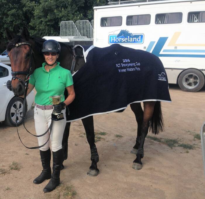 CHAMPIONS: Sally Townsend and Marley with their trophy for winning the 2016 ACT Show Jumping Club Masters Plate for the most successful Show jumper and horse combination over two weekends. Photo: Supplied