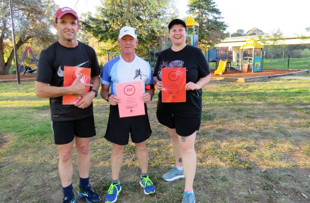 MILESTONES REACHED: Pete Edwards, David Ault and Tanya Henshaw were awarded with certificates at Riverbank Park for reaching running milestones. Photo: Supplied