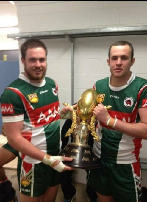 BROTHERS IN ARMS: The Warner brothers with their premiership trophy at the Cootamundra Bulldogs. In 2017, they join the Magpies. Photo: Supplied