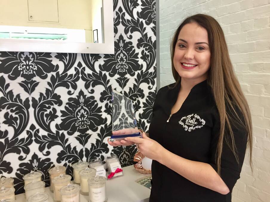 RECOGNITION: Jessica Robertson, founder of Bello Beauty, with her Yass Valley Business 'Young Entrepreneur Award' while she waits for a client. Photo: Toby Vue.