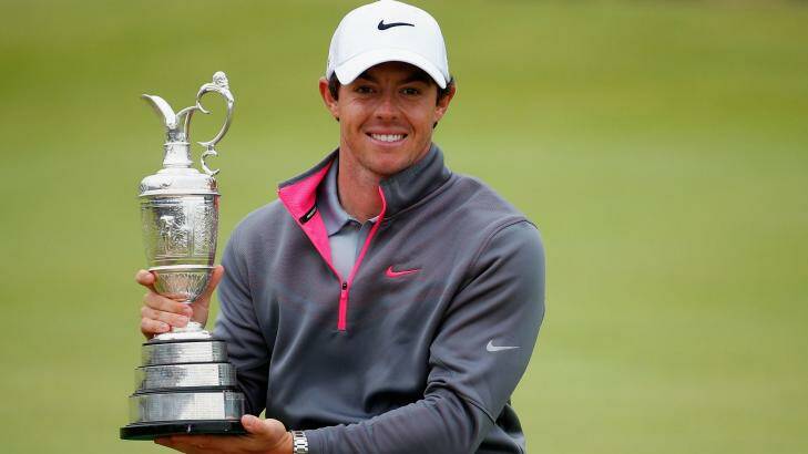 Rory McIlroy, of Northern Ireland, holds the Claret Jug after his two-stroke victory at the Open Championship at Royal Liverpool.   Photo: Tom Pennington