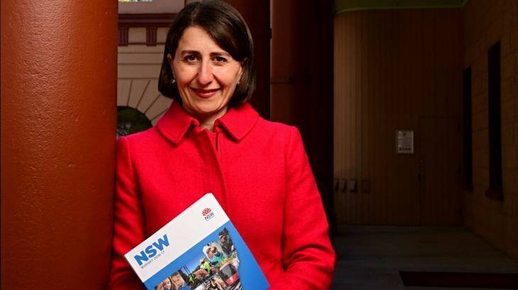 State Treasurer Gladys Berejiklian with the 2017-17 budget papers outside State Parliament on Monday. Photo: Wolter Peeters