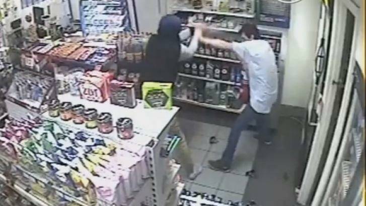 CCTV stills showing the attendant at Tarro's Metro service station as he attempts to fight back against the armed robbers.