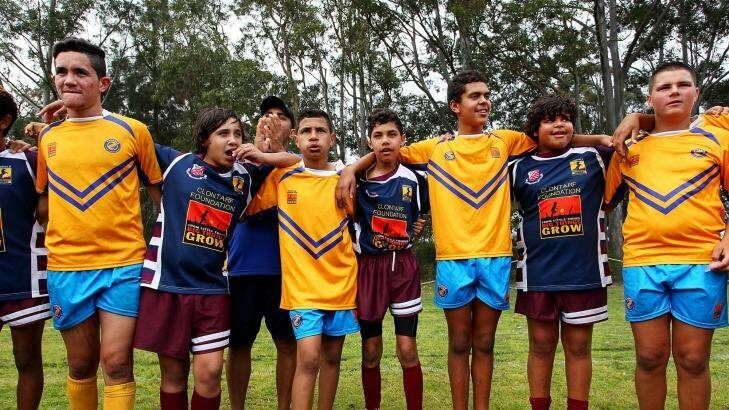 Congratulations: Players from Armidale and Moree unite following a match during the Clontarf Rugby League Festival. Photo: Lisa Maree Williams/Fairfax Media via Getty Images