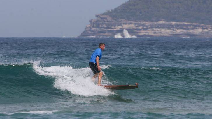 Premier Mike Baird began surfing more than 30 years ago.
 Photo: Dallas Kilponen