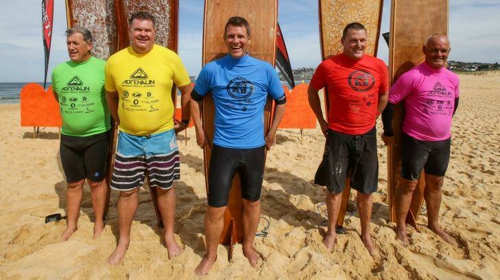 Premier Mike Baird with fellow competitors for the Vintage Wood heat at the 2015 MalJam surfing competition. Photo: Dallas Kilponen