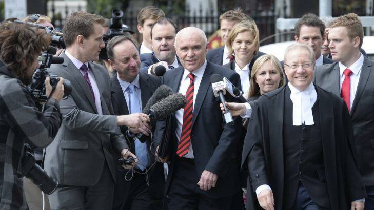 Essendon chairman Paul Little and his legal team look confident before the judgement. Photo: Justin McManus