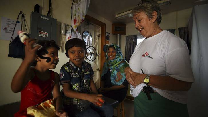 Carol Nagy with Fatma, 4, Mohamed, 6, and their mother Nasma, on-board the MY Phoenix. Photo: Kate Geraghty