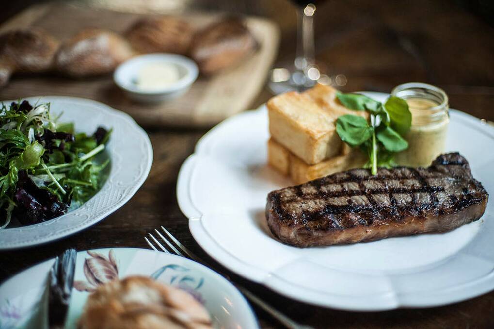 Bistro Vue chef Chris Bonello's finished French bistro classic, steak frites (or in this case, steak and pommes pont neuf). Photo: Josh Robenstone/Getty Images