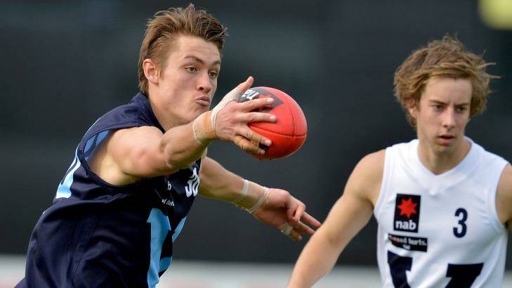 Darcy Moore (left) in action for Vic Metro against Vic Country in May. Photo: Joe Armao