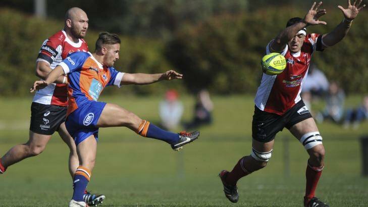 Sydney scrumhalf Dewet Roos clears the ball past Rory Arnold while playing in the NRC. Photo: Graham Tidy