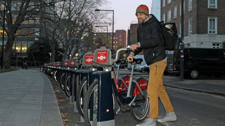 A man takes a Santander bike in London on Monday. Photo: Latika Bourke