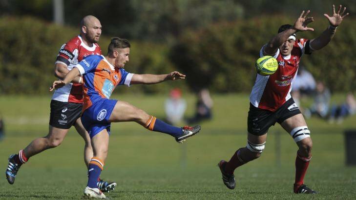 Sydney scrumhalf Dewet Roos clears the ball past Rory Arnold while playing in the NRC. Photo: Graham Tidy
