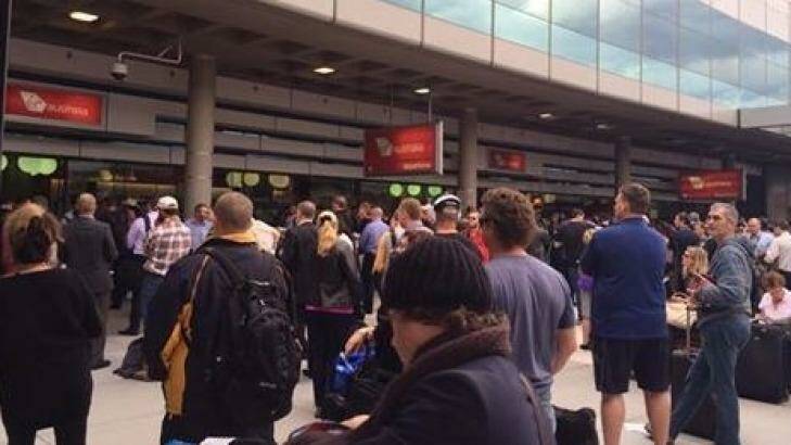 Passenger wait outside the terminal after being evacuated. Photo: Emma Etherington/Facebook