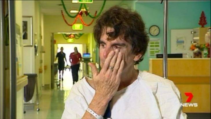 Mr Long wipes tears from his eyes as he recalls the crash. Photo: Seven News
