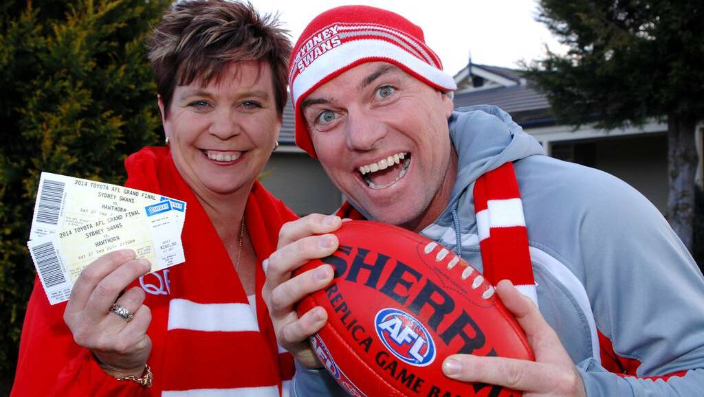 Liz and Mark Kennedy have done the hard yards to be at today’s AFL grand final. Photo: ZENIO LAPKA