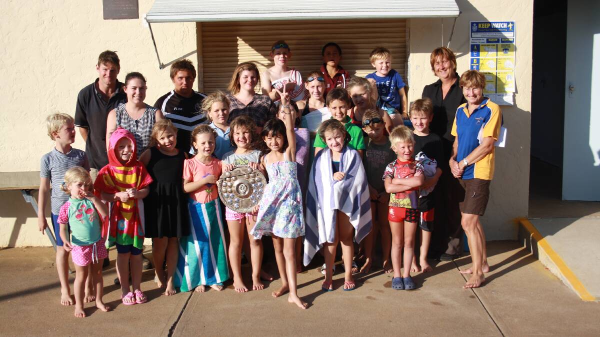 Group jpg. caption: the Binalong swimming club are hoping to hold onto the Shine Shield for another year after being victorious in the Febuary 2014 tournament. The team is pictured with wimming coaches Belinda Pigram and Jan Giles (far right). Photo: Contributed. 