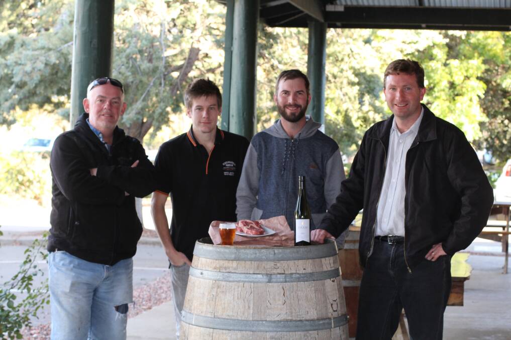 (L-R): Rob Rice, Andrew McLean, Touie Smith Jnr and Michael Pilbrow at the Murrumbateman Inn with some of the products Murrumbateman has to offer: fine wine, meat and a frothy beer. Photo: Jessica Cole.