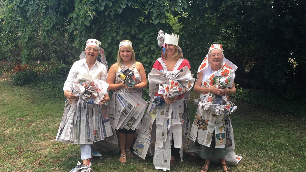 Winners are grinners: Ginny Hewlett, Riley Howarth (Ann's granddaughter), Mel Lyons (Ann's daughter) and Maggie Smith had great fun making wedding dresses from newspaper. Photo: Supplied.