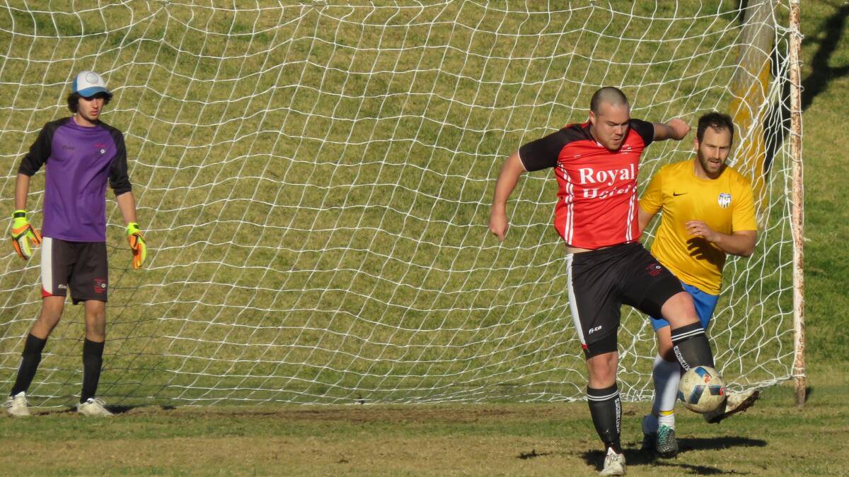 Ryan Betts shuts down Canberra City's attack. Photo: Sue Nielson.