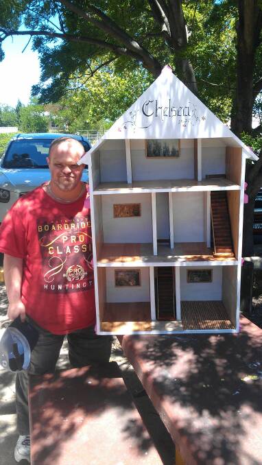 James Demestre (left) together with Daniel Anderson and David Staines (mentor) worked together to make Freddie's Dog House. INSET: Zac Croker worked with Yass Men's Shed members to put together this doll's house. Photos: Supplied.
