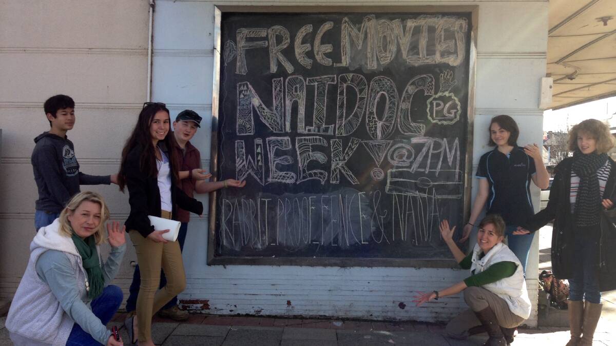 Yass Valley Youth Council at the Liberty Theatre hosting movies for NAIDOC and in front of the chalk sign designed by Tyahn Bell. 