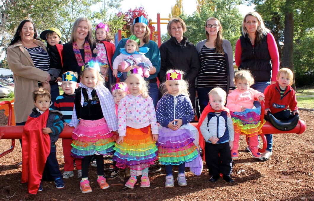 Family day care educators and children with director Julia Morphett (third from right).