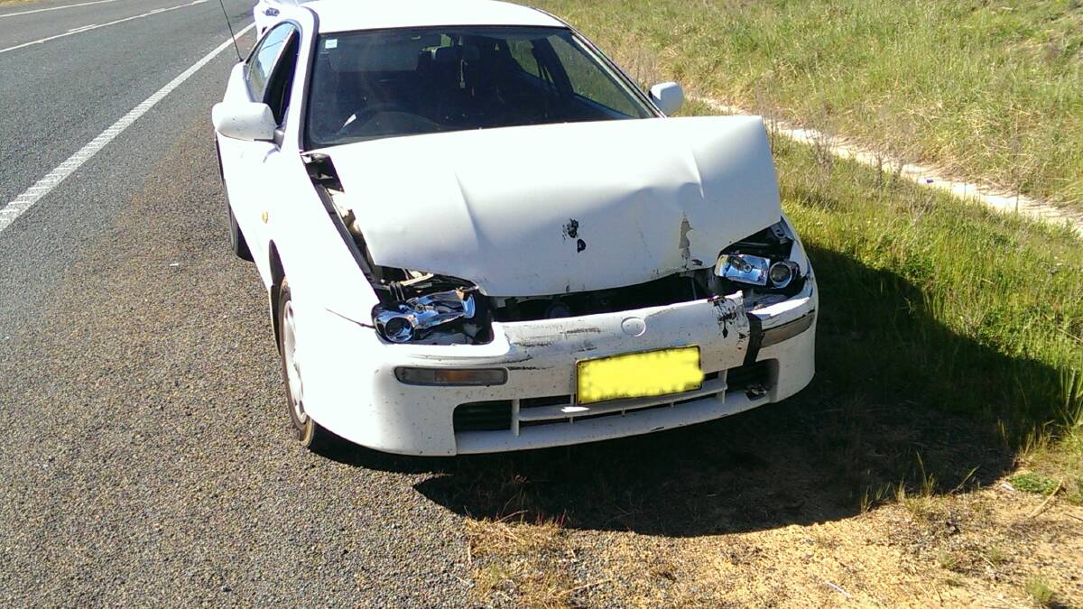 A car that smashed into a semi-trailer just south of Murrumbateman earlier this year; the passenger narrowly avoiding injury. Photo: Bob Tindall. 